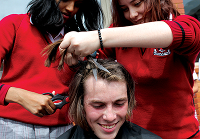 Students participating in the "Shave for a Cure Day" fund-raising event